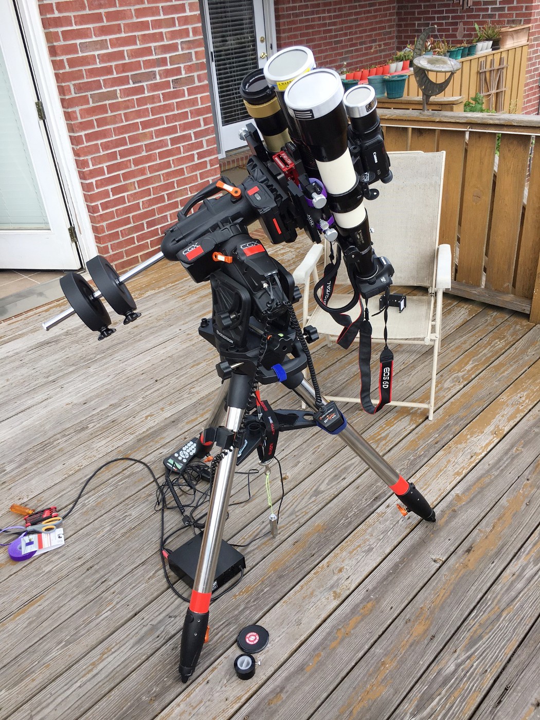 Eclipse imaging setup using a Televue 85 with Canon 6D DSLR and 1000 Oaks Type 2 white light solar filter, Orion ED80 with Canon 60Da and Orion glass solar filter, Canon G40 camcorder with 1.5X converter lens, 1000 Oaks Type 2 filter, Coronado Solarmax 60 h-alpha double stacked (will use PGR Grasshopper 3 camera), Hinode Solar Autoguider, on a Celestron CGX mount. Canon cameras will be controlled by Eclipse Maestro software on a Apple Macbook.
