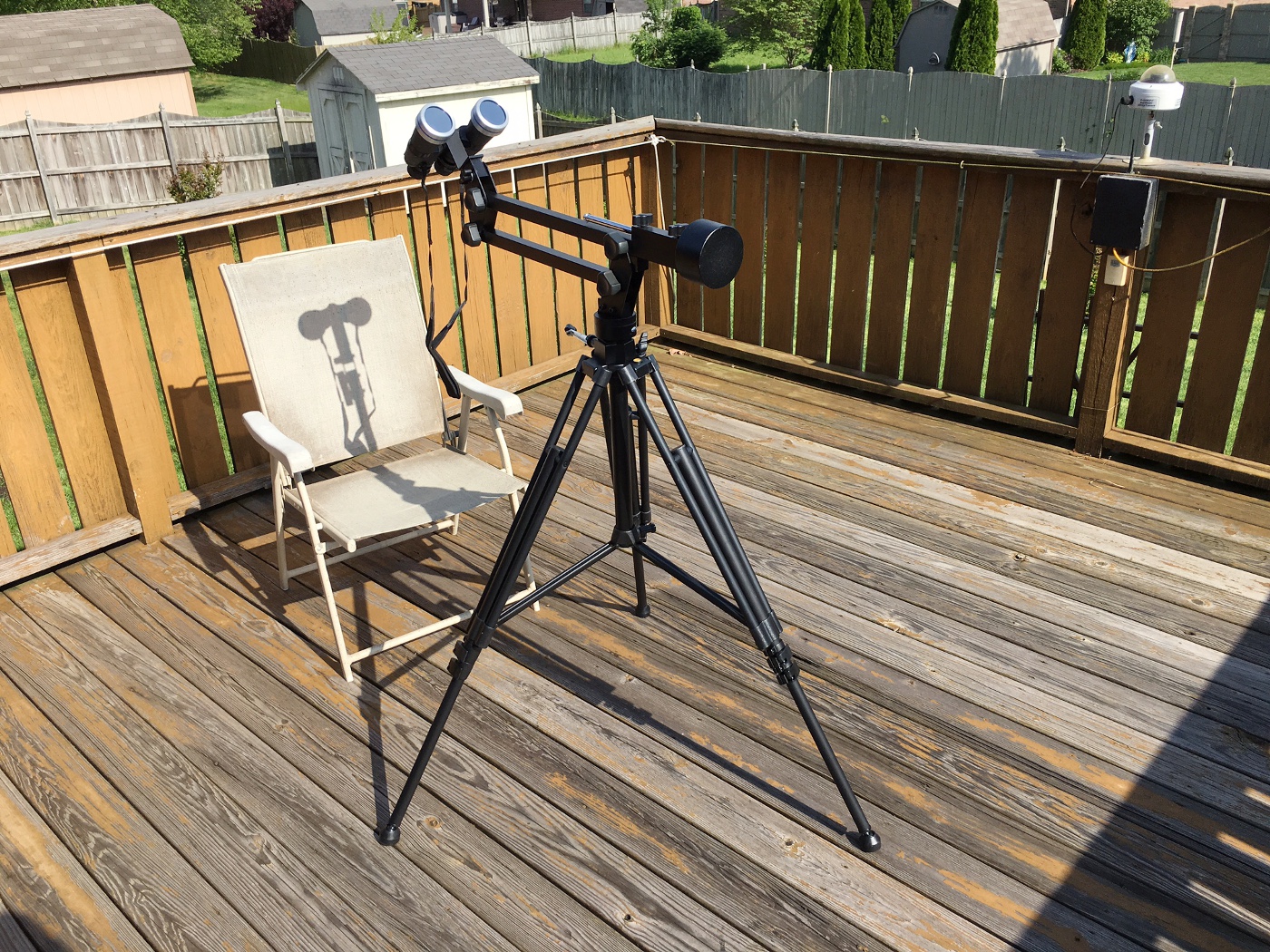 Orion 10-30x50 binoculars with Orion glass solar filters on an Orion Paragon parallelogram mount for visual observing of the eclipse.